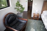 Black Leather Armchair with Potted Plant by the Window