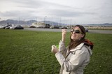 Woman Flying a Kite at San Francisco Waterfront