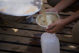 Pouring Milk into a Bowl