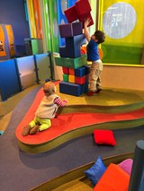 Children Building Tower with Oversized Foam Blocks