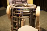 Wooden Machine with Wheel on Top