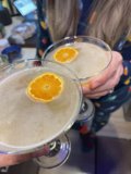 Refreshing Citrus Cocktail Caption: A person in San Francisco enjoys a delicious cocktail made with freshly squeezed orange juice and other citrus fruits on Christmas day.