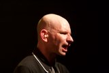 The Bold Bald Man on the Mic