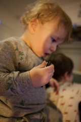 Young Child Eating Pizza in Cozy Home Setting