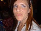 Red-Haired Woman with Red-Eye Effect at Restaurant