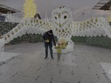 Father and Child at Giant Snowy Owl Sculpture