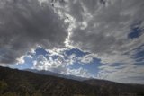 Majestic mountain range and cumulus clouds