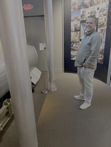 Museum Visitor Smiling at Interactive Space Exhibit