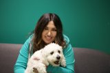 A Happy Woman and her White Dog
