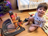 Happy Child Playing with Construction Toy Set at Christmas