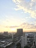 Sun sets over the urban skyline