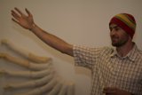 Man with a bone and a beanie