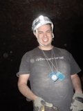 Helmeted Man Shining Light
