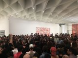 Art Gallery Crowd Admires Large Painting