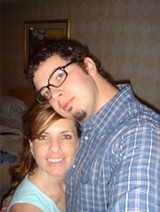 Couple Posing Together at Indoor Gathering