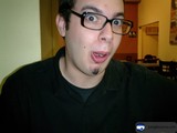 Portrait of Dave B in Black Shirt and Glasses