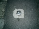 Abandoned Car Wheel with a Hole