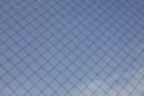 Texture of the Sky through a Chain Link Fence