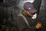 Hoodie-wearing man sports blue baseball cap