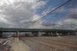 Train Passing Under Overpass
