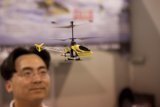 A Man and His Helicopter Toy