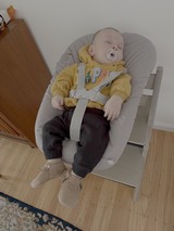 Baby Relaxing in Modern Bouncer Chair