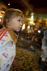 Young Child Admires Ornate Carousel at Madonna Inn