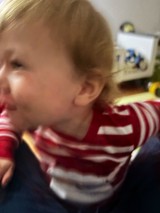 Young Child in Red Striped Shirt Close-Up Portrait