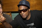 Black shirt, hat, and shades