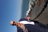 Business Professional Taking Seaside Selfie with Drink