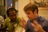 Two Men Enjoying a Cold Beer at the Restaurant