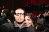 Friends Pose Together at Dimly Lit Nightclub