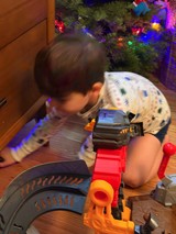 Christmas Morning Play: Child with Toy Train Set
