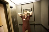 Woman Relaxing in Vintage Elevator on Election Night