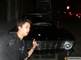 Man pointing at sleek sports car