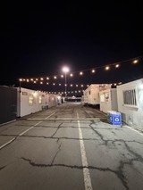 Empty Event Venue Pathway at Night with String Lights