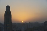 Urban Sunset Behind a Skyscraper
