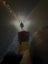 Underground Tunnel Boat Journey Through Narrow Passage