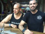 Two bearded men enjoying drinks at a Long Beach restaurant