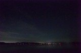 Starry Night Over Lake Tahoe's Distant Shoreline