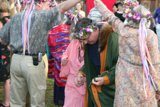 Green Shirted Man Holding a Flower Bouquet at a Wedding
