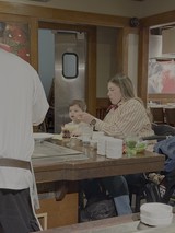 Mother and Child Dining in Japanese Restaurant