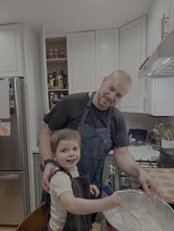 Father and Son Cooking Together in Kitchen