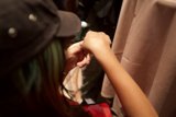 Green-haired Woman Puts on Hat in Las Vegas