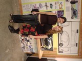 Two Women Posing at Art Exhibition Display