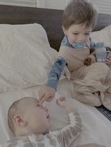 Tender Big Brother Moment with Newborn Baby