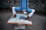 Whimsical Public Art: Reader Standing Over Open Book