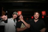 Three Men at a City Pub