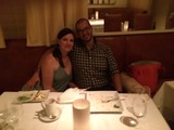 Couple Smiling Together at Restaurant Dinner Table