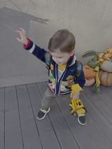 Toddler Playing with Yellow Toy Truck